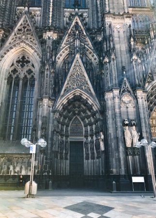 Cathedral in Cologne. The cathedral is very old and has a lot of detail. The building is very tall and has a lot of windowsの写真素材