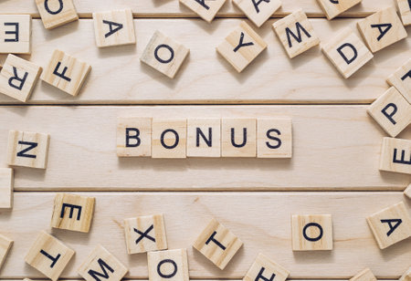 Bunch of wooden letters spell out the word bonusの写真素材