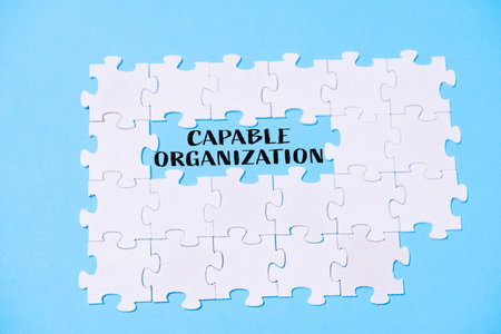 Jigsaw puzzle with the word "capable organization" written in the middleの写真素材