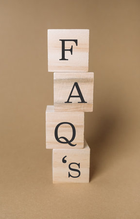 Stack of wooden blocks with the letters F, A, Q, and S on topの写真素材