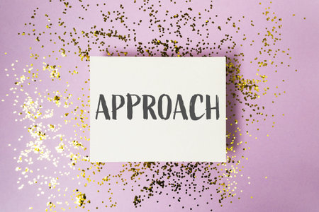 White card with the word approach written on it. The card is surrounded by gold glitterの写真素材