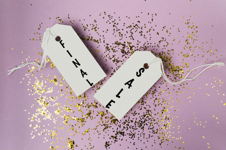 Two tags with the word written on them. One tag is on the left and the other is on the rightの写真素材