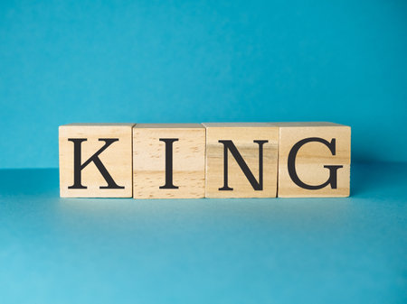 Wooden block with the letters KINGの写真素材