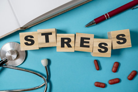 Stack of wooden blocks with the word stress written on themの写真素材