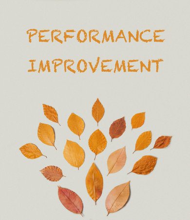 Poster with leaves and the words performance improvement written on itの写真素材