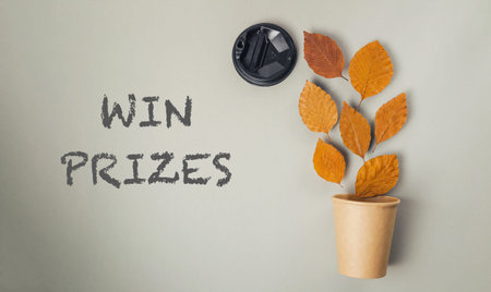 Leafy plant is on a white background with the words win prizes written below itの写真素材