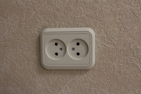 white electrical outlet on the wall in the room