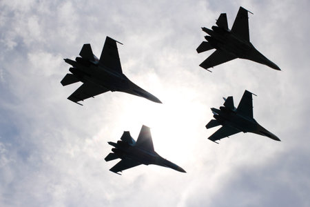 Four aircraft combat fighters SU-34 military fighters flying in the sky a great strong powerful