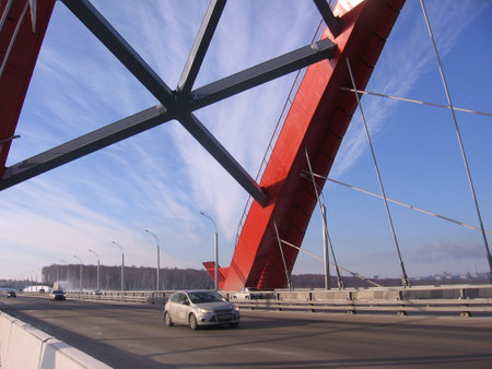 Russia, Novosibirsk, 01.01.1980: metal engineering structure of pipes arch bugrinsky bridge under it enters the car from the roadのeditorial素材