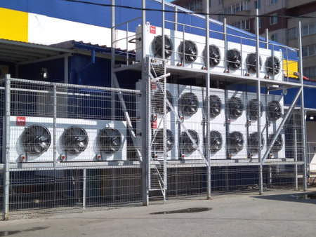 Russia, Novosibirsk 08/29/2019: hood fans on the facade of an industrial building air conditioners for coolingのeditorial素材