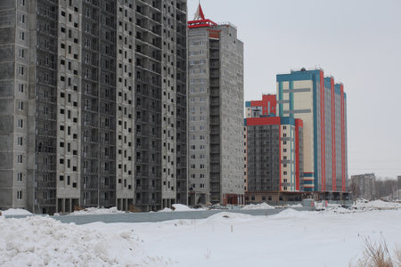 Russia, Novosibirsk, February 8, 2015: new residential complex under construction on the construction site high apartment buildings housesのeditorial素材