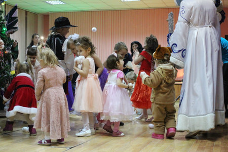 Russia, Novosibirsk 27.12.2018: happy children dance in carnival costumes at the New year holidayのeditorial素材