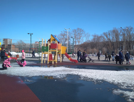 Russia, Novosibirsk 04.04.2021: children play on the children's playground with attractions in the parkのeditorial素材