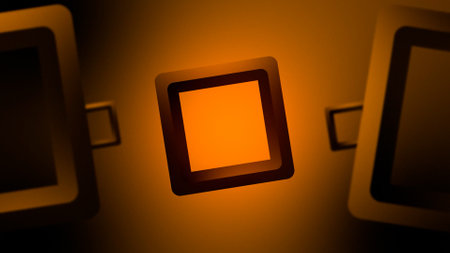 Digital composite of 3D Square icons in orange light against black backgroundの写真素材