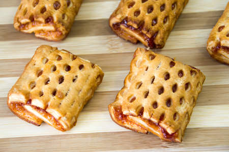 Homemade puff pastry with Apple jam lying on a white backgroundの写真素材