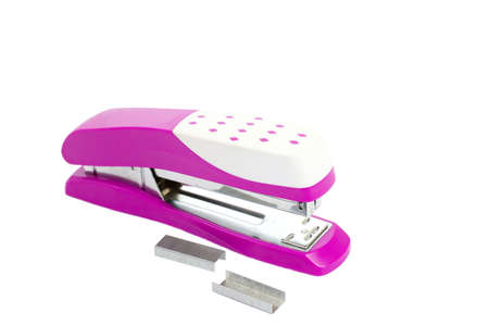 Closeup pink stapler office equipment isolated on white background with clipping pathの写真素材