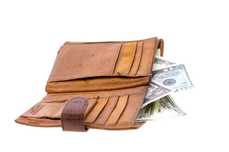natural leather wallet isolated on white background. Expensive man's purse closeup. Wallet filled up...