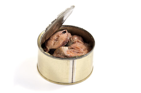 Opened metal can with conserved sardines fish isolated with clipping path