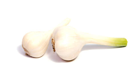 Fresh organic garlic and cutted garlic clove isolated on white backgroundの写真素材