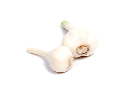 Fresh organic garlic and cutted garlic clove isolated on white backgroundの写真素材