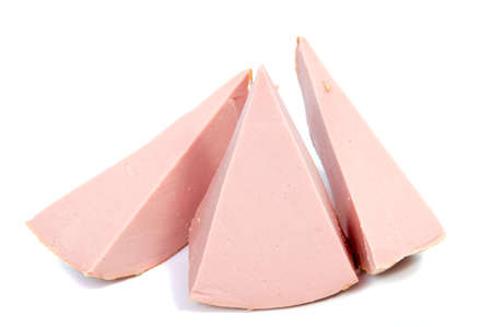 Boiled sausage ham slices on white backgroundの写真素材