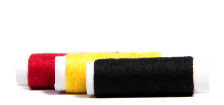 Colorful spools of thread isolated on white background
