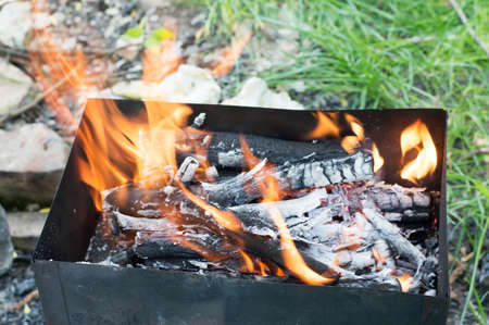 Barbecue Grill with Fire on Natureの写真素材