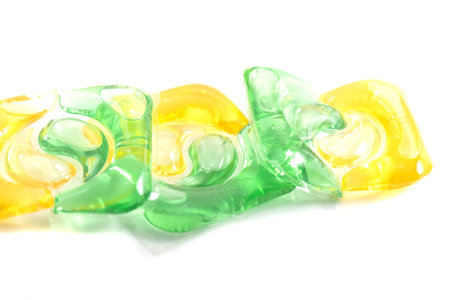 Washing gel capsule pod with laundry detergent isolated on white background.の写真素材