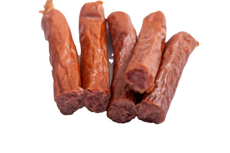 Smoked sausage and meat on a white background