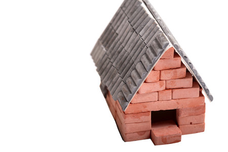 An old small wooden house on a white backgroundの写真素材