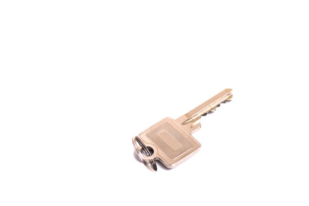 details of key ring with various door and car keys against a white background
