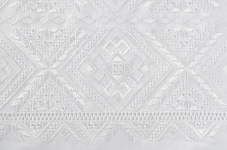 Embroidered element. Embroidered with white silk threads