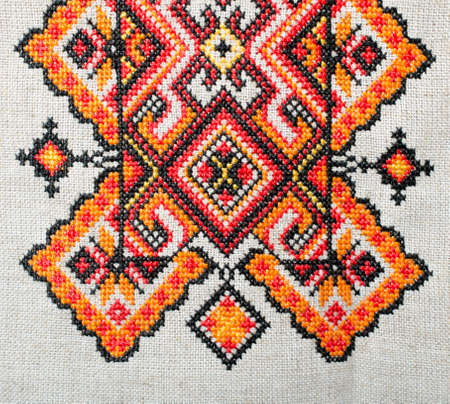 multicolored embroidered element on linen cotton threadsの写真素材
