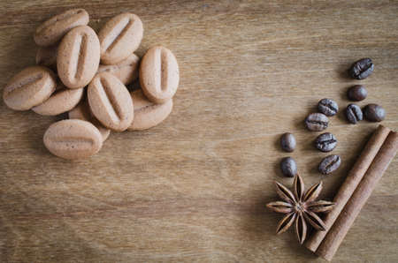 Cookies coffee with spice and on wooden background. Coffee break, relax time. Selective focus. Top view.の写真素材