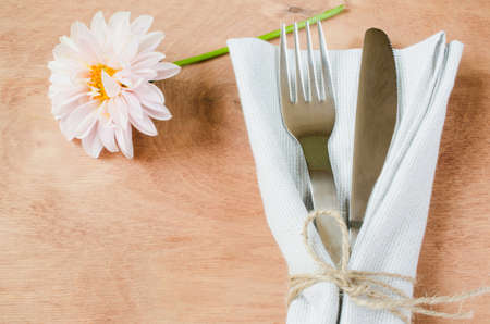 Spring table settings with fresh flower, napkin and silverware. Holidays background. Selective Focus.の写真素材