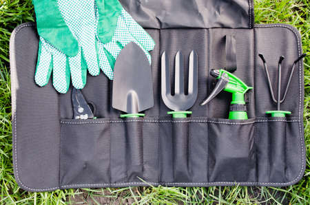 Gardening Tools in the Bag on the Grass. Concept Gardening and Agriculture. Selective Focus.の写真素材