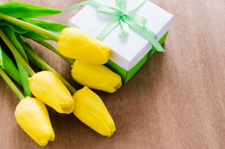 Festive Table Setting in White, Green and Yellow With Tulip. Concept Spring, Easter or Mother's Day. Selective Focus.の写真素材