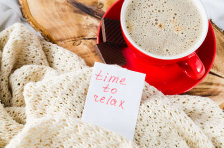 Cup of Hot Cappuccino and Chocolate in the Bed, Notes Time to Relax, Lazy Morning. Selective Focus.の写真素材