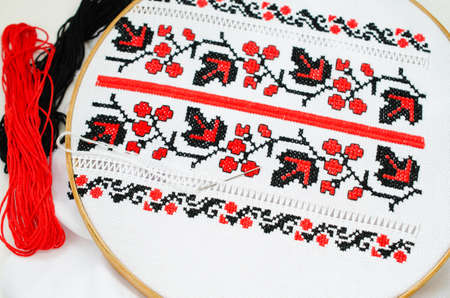 Slavic Cross Stitch by Red and Black Threads in the View of Viburnum. Ukrainian Folk Embroidery Pattern. Hemming.の写真素材