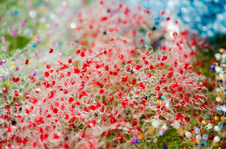 Beaded jewelry. Bright background, colorful beads at outdoor crafts market. Hand made souvenirs...