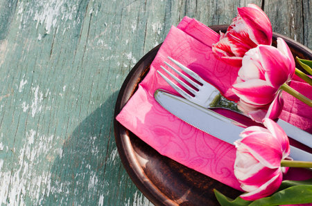 Festive Table Setting With Pink Tulips. Holliday Table Set for Mother's Day or Birthday. Selective...