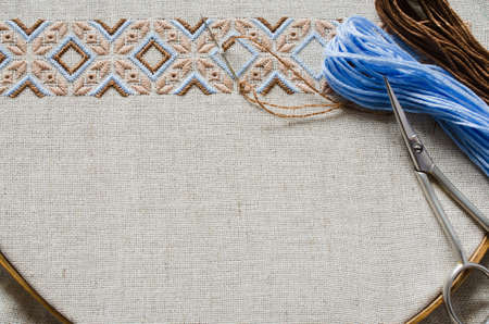 Slavic cross stitch by brown and beige threads. Design of ethnic pattern.の写真素材