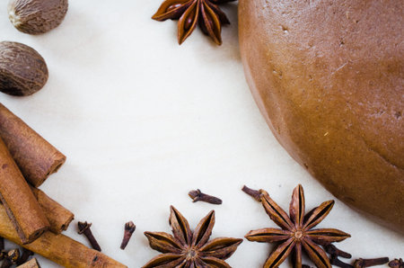Cooking Christmas cookies. Gingerbread dough with spice. Forms for Christmas cookies gingerbread, rolling pin, cutter.の写真素材
