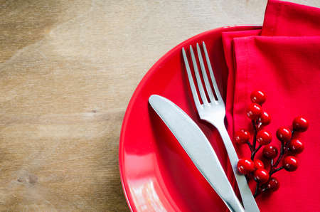 Festive Table Setting With Christmas Decorations on Rustic Wooden Background for Christmas Eve. Top View. Copy Space. Selective Focus.の写真素材