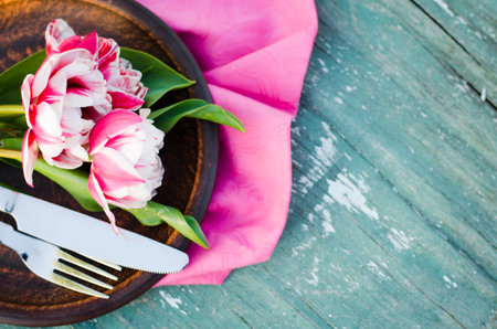 Festive Table Setting With Pink Tulips. Holiday Table Set for Mother's Day or Birthday. Selective...