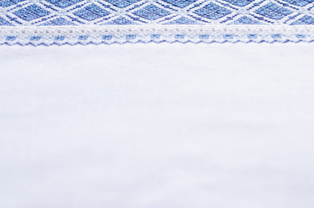 Element handmade embroidery on linen by white and blue cotton threads. Craft embroidery. Design of...