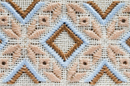 Element handmade embroidery on linen by brown and beige cotton threads. Craft embroidery. Design of...
