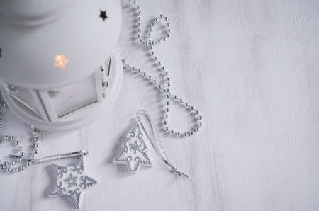 Christmas lantern with decorations over white wooden background. Magic lightning background, copy spaceの写真素材