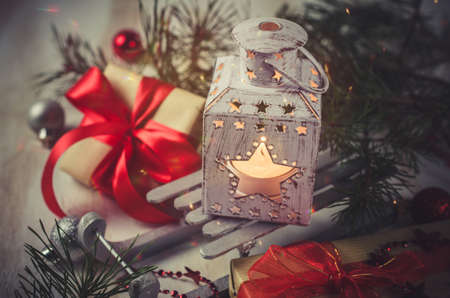 Christmas lantern with decorations over white wooden background. Magic lightning background, copy spaceの写真素材