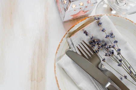 Festive table setting at vintage or provence style with candles and lavender. Concept Birthday, Valentine's, Mother's or Father's Day. Closeup. Copy space, top view.の写真素材